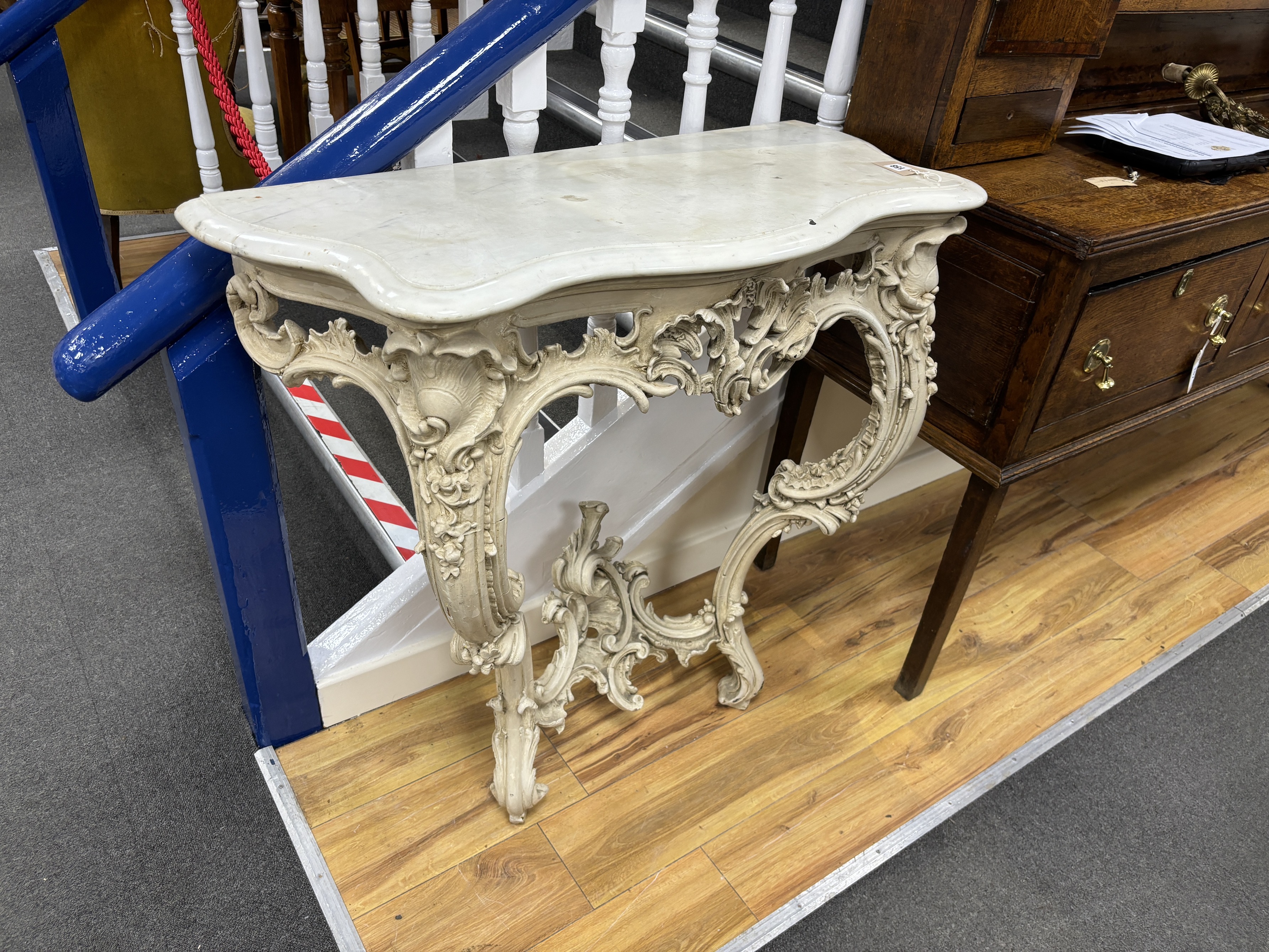 A Victorian carved wood and composition marble top serpentine console table, width 88cm, depth 45cm, height 90cm